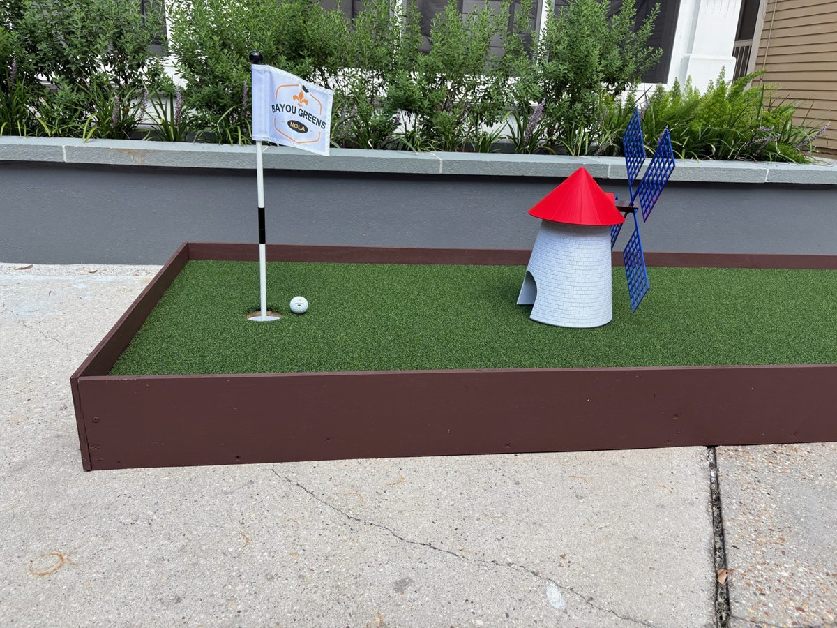 Windmill mini-golf hole on a green lane