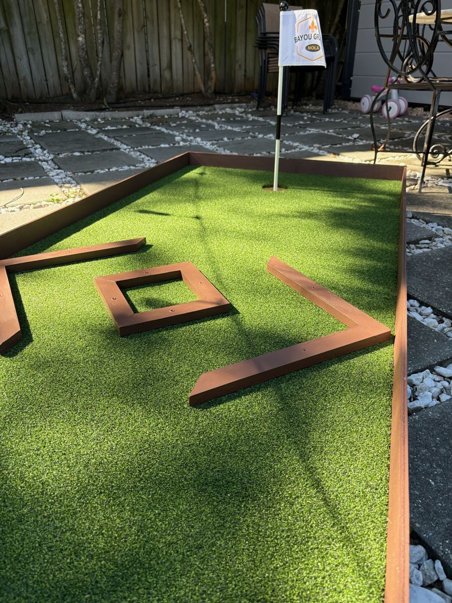 Close-up of the diamond bumper obstacle on a mini-golf lane